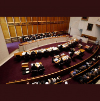 Should laws prohibit police wearing their firearms and appointments in NSW Courts?