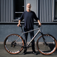 He had a hard time finding bikes that fit, so he designed one with 36-inch wheels