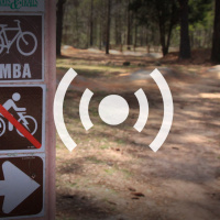 Electric Mountain Bike Trail Access and Adoption