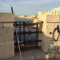 To Sicily: Early morning reflections by the sea