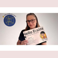 Zilla Carina applies first aids inside her book The Scars We Carry