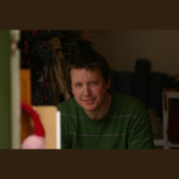 Ed Holroyd, explaining TWEAVE in the background, you can hear Rosie carding wool fibres, ready for spinning