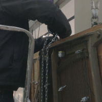 Kathy Hindes Piano Migrations piece being winched and lifted into place