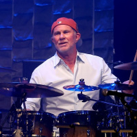 Red Hot Chili Peppers drummer Chad Smith is excellent on music, his foundation, and why hes playing during halftime at Homecoming