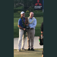 Emily T Gail in 2017 with Greg McLaughlin, President, PGA TOUR Champions 