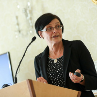 Patricia Marsh , speaking at a Great Influenza Pandemic seminar hosted by President Higgins
