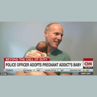 Carlos  Kiki chat w/ Officer Ryan Holets about his new adoption.