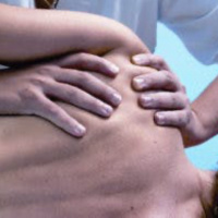 Massage Therapist learning Time With Travis. 