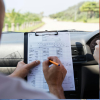 Why do driving test pass rates vary widely at different centres?