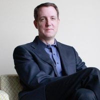 Motley Fools Chris Hill: What Michael Lewis Says About CEOs and Their Pay