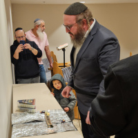 The Thankful Siyum of Hilchos Chanukah Lit Learning Weekly in the Office!